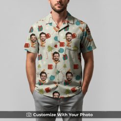 Man in funny Christmas Hawaiian shirt featuring faces, red gifts, and green trees
