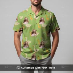 Man in light green Hawaiian shirt featuring ducks and sunglasses with playful vibe