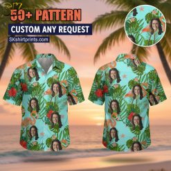 Man wearing colorful funny Hawaiian shirt standing on tropical beach setting with palm trees