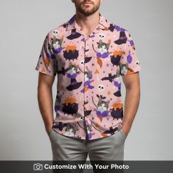 Man wearing funny pink cat face Hawaiian shirt with bats and cauldrons pattern