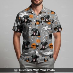 Man in Halloween aloha shirt with black dog, skeletons, and orange pumpkin patterns