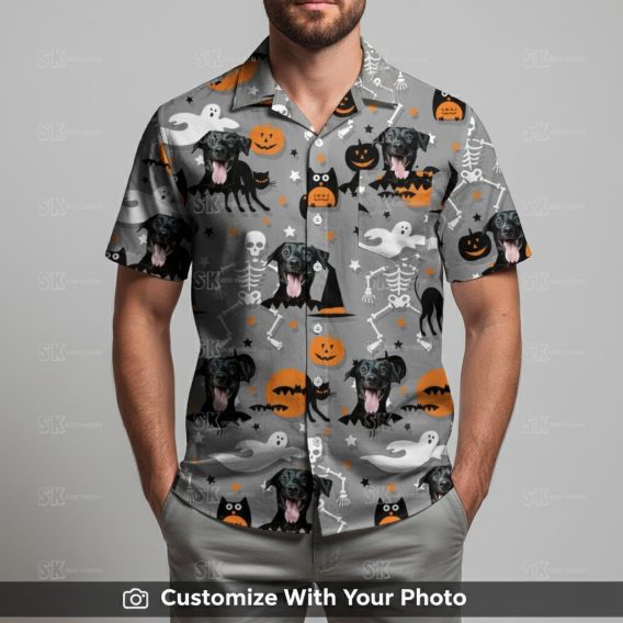 Man in Halloween aloha shirt with black dog, skeletons, and orange pumpkin patterns