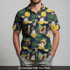 Man in Hawaiian cat shirt featuring bananas, papayas, palm leaves and pink flowers