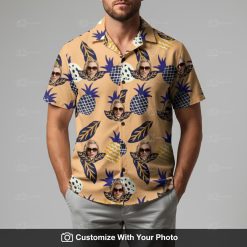 Man styling Hawaiian shirt with yellow pineapples, blue and peach tropical pattern