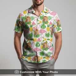Man in bold lion print Hawaiian shirt with pineapples and pink tropical accents