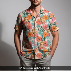 Man in pink Hawaiian shirt featuring lion print and green leaf tropical accents