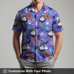 Man in a purple Hawaiian shirt with Halloween cats, skulls, and bats for parties