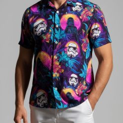 Man in Star Wars Hawaiian shirt standing on beach boardwalk during golden hour vacation photo