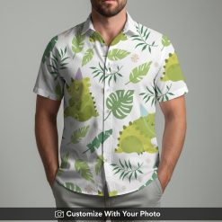 Man wearing vintage dinosaur button down shirt with party hat and tropical flowers