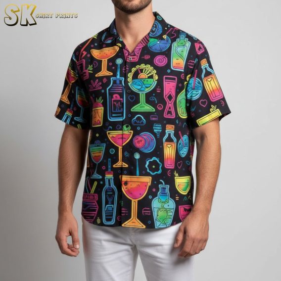 Male model in tropical drink print Aloha shirt at poolside party setting with cocktail decorations visible
