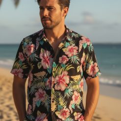 Multiple Hawaiian shirt designs for women displayed side by side showing various tropical patterns and color options