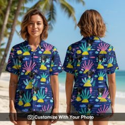Woman wearing fun blue Spongebob Hawaiian shirt with black dog face and tropical patterns