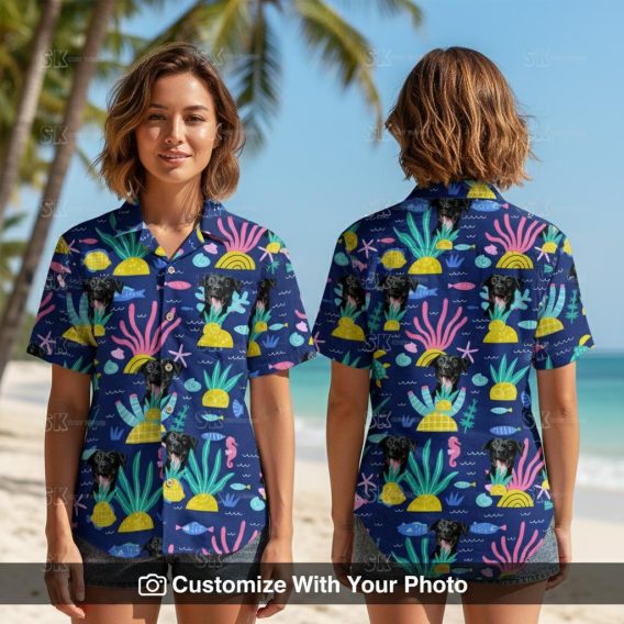 Woman wearing fun blue Spongebob Hawaiian shirt with black dog face and tropical patterns