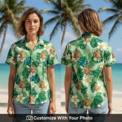 Woman wearing green Hawaiian shirt with bold lion print and tropical leaf details
