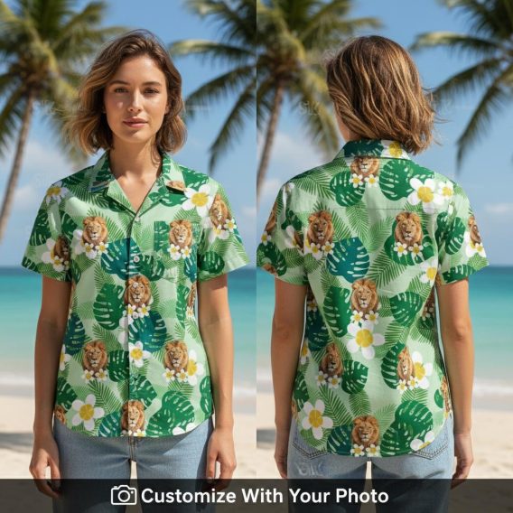 Woman wearing green Hawaiian shirt with bold lion print and tropical leaf details