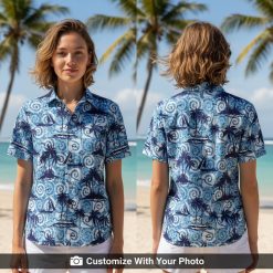 Woman wearing blue Hawaii shirt with palm trees and sailing boats at the beach