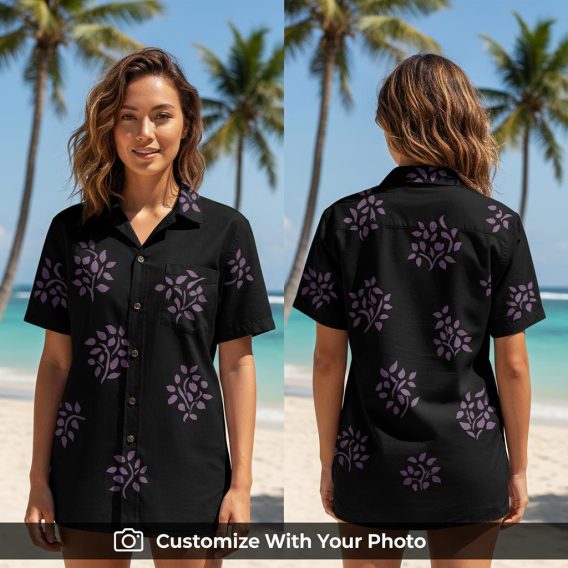 Woman wearing black floral Hawaiian shirt with bold purple leaf pattern outdoors