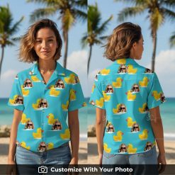 Woman in bright blue Hawaiian shirt with yellow rubber ducks and sunglasses faces
