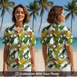 Woman wearing cat print Hawaiian shirt with vibrant fruit and palm leaf pattern outdoors