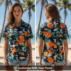 Woman wearing Hawaiian shirt with cows, orange hibiscus flowers, and green palm leaves