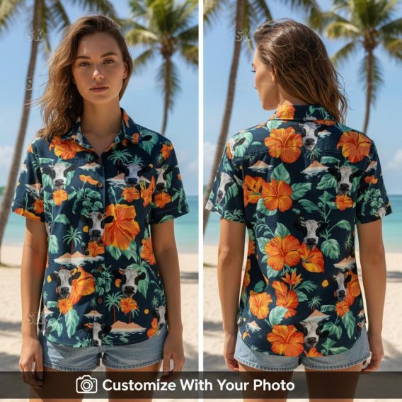 Woman wearing Hawaiian shirt with cows, orange hibiscus flowers, and green palm leaves