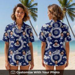 Woman wearing a blue custom Hawaiian shirt with white dragon and face designs