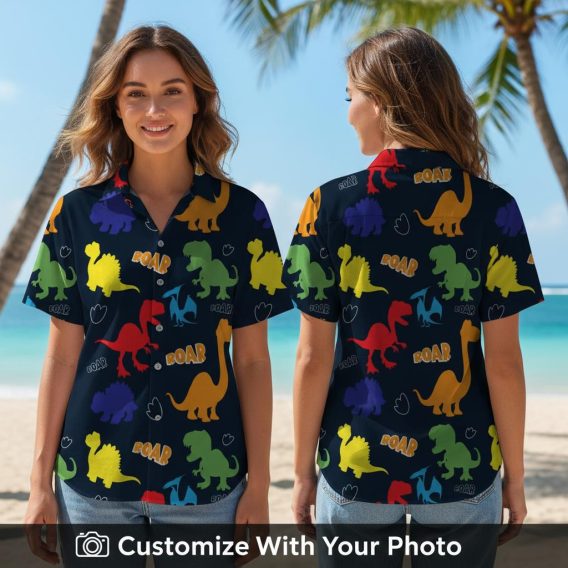 Woman wearing dinosaur Hawaiian shirt with colorful dinosaurs and 'ROAR' details