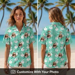 Woman wearing Donald Duck Hawaiian shirt with white swans, pink flowers and grass