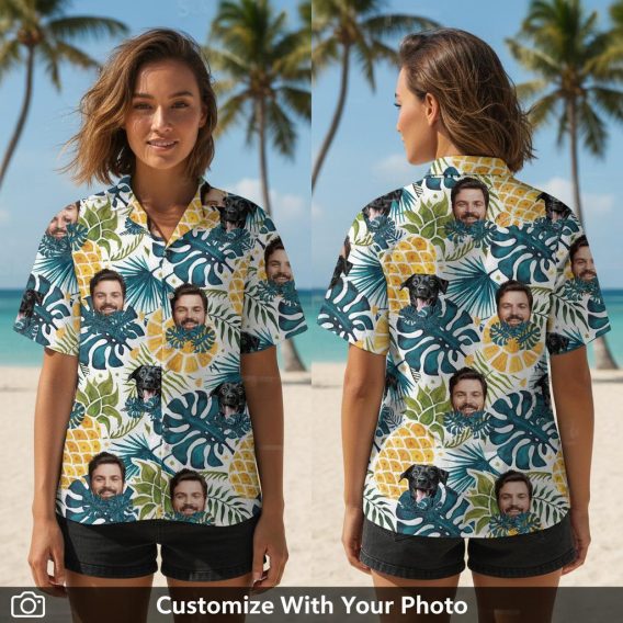 Woman wearing funny Hawaiian shirt featuring black dog, blue leaves, and pineapples