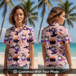 Woman in pink Halloween cat face Hawaiian shirt with pumpkins and witch hats