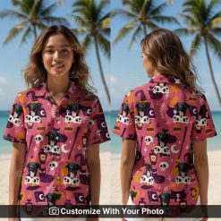 Woman wearing Halloween Hawaiian shirt with black dog, pink and purple witch design