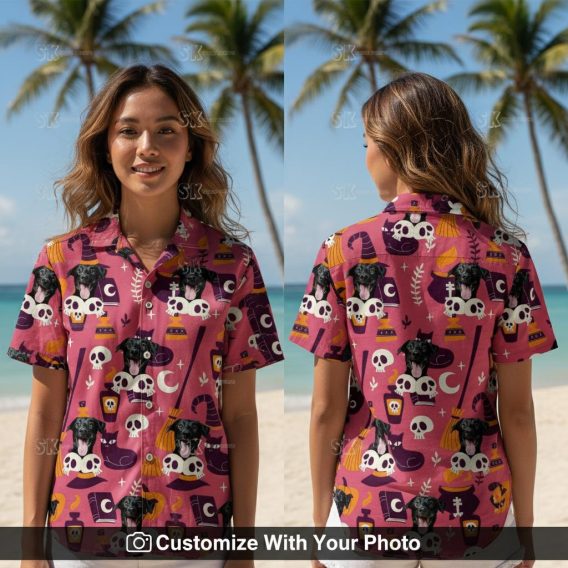 Woman wearing Halloween Hawaiian shirt with black dog, pink and purple witch design