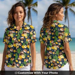 Woman wearing Hawaiian shirt with face print, coconuts, oranges, vibrant flowers outdoors