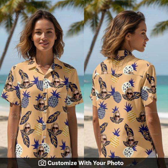 Woman wearing a Hawaiian shirt with peach, yellow pineapple and sunglasses print