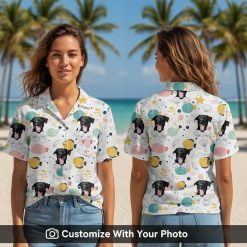 Woman wearing white Hawaiian Spongebob shirt with dog's face, seashells, and starfish