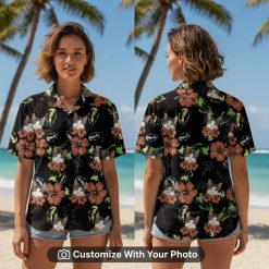 Woman wearing custom cat Hawaiian shirt with hibiscus and tropical leaves by the beach