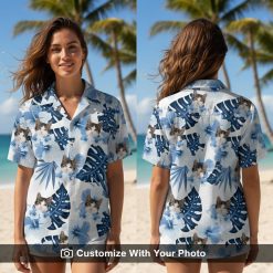 Woman wearing Taco Cat Hawaiian Shirt with blue tropical leaves and hibiscus flowers