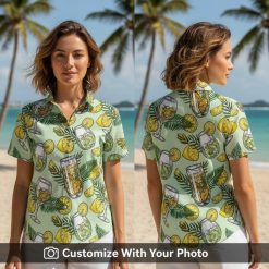 Woman in tropical cocktail glass print Hawaiian shirt with citrus and foliage details