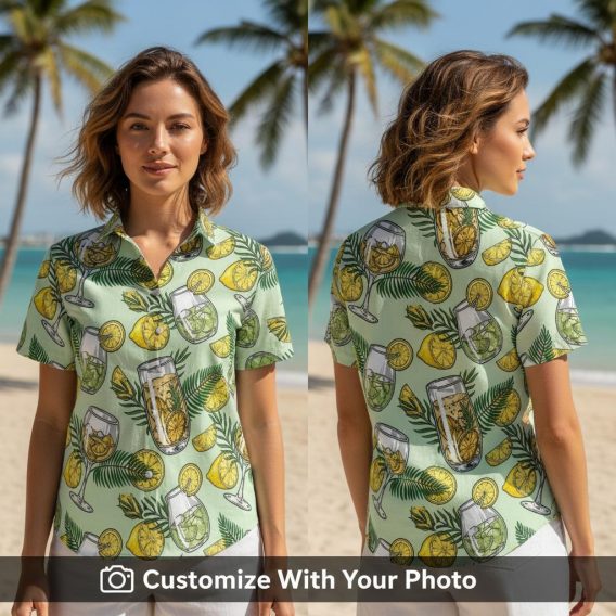 Woman in tropical cocktail glass print Hawaiian shirt with citrus and foliage details