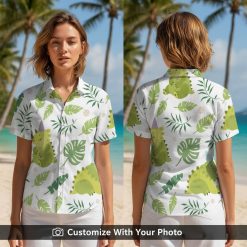 Woman smiling in vintage dinosaur Hawaiian shirt with green dinosaur and tropical leaves