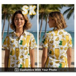 Woman wearing yellow Hawaiian shirt with lemons and cocktails, summer vacation style