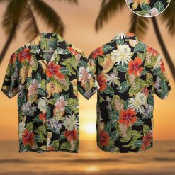 1940s Hawaiian shirt with bright orange red yellow floral pattern on dark background vintage aloha style