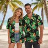 Black and gold Hawaiian shirt displaying cats with golden tropical flowers and green leaves