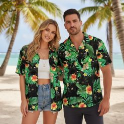 Black and gold Hawaiian shirt displaying cats with golden tropical flowers and green leaves