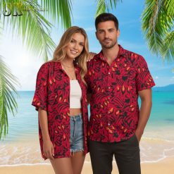 Black red Hawaiian shirt with flame-like abstract patterns worn outdoors in tropical setting
