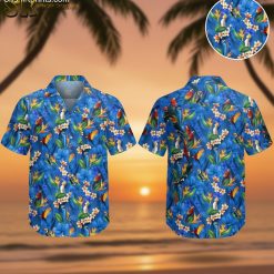 Blue aloha shirt featuring colorful parrots, toucans, and tropical flowers including orange bird-of-paradise and white plumeria