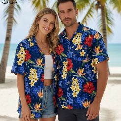 Blue floral Hawaiian shirt with red hibiscus, yellow plumeria, and orange tropical flowers on navy background