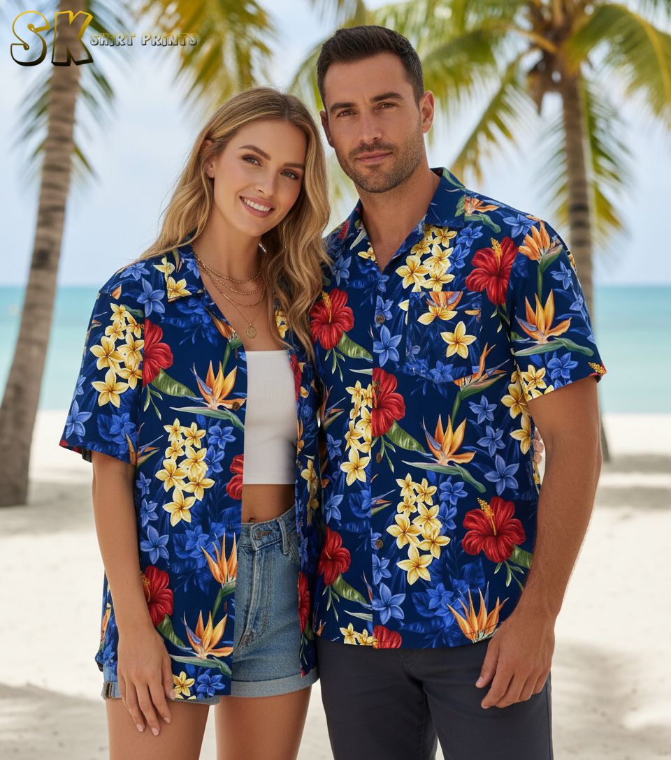 Blue floral Hawaiian shirt with red hibiscus, yellow plumeria, and orange tropical flowers on navy background