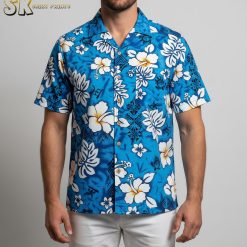Blue floral hawaiian shirt displaying white hibiscus blooms and tropical leaf patterns on vibrant blue fabric