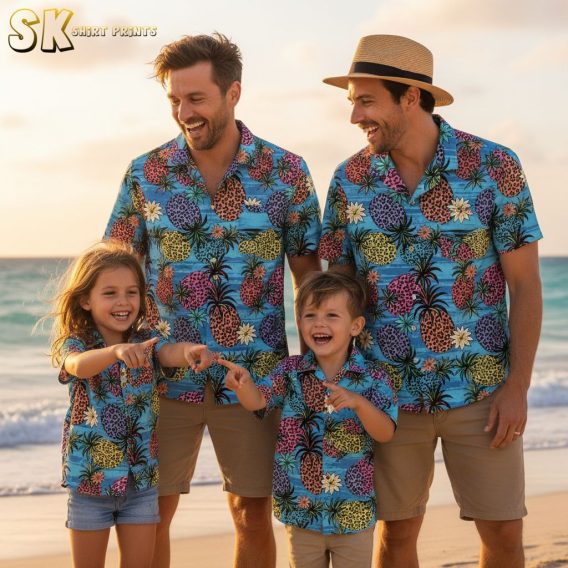 Blue floral Hawaiian shirt combining pineapples and hibiscus flowers with tropical foliage in colorful arrangement